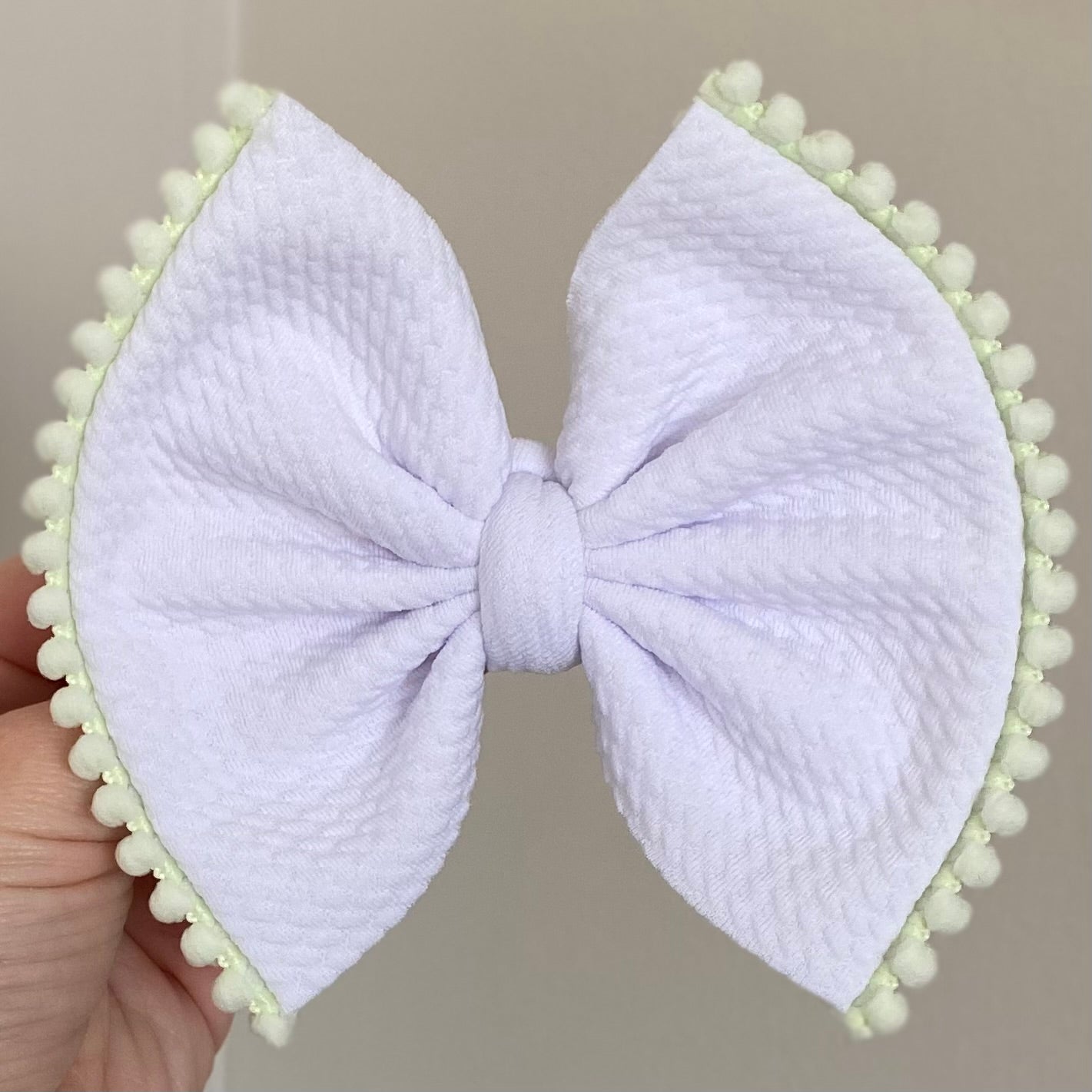 Pom Pom Trimmed Bow