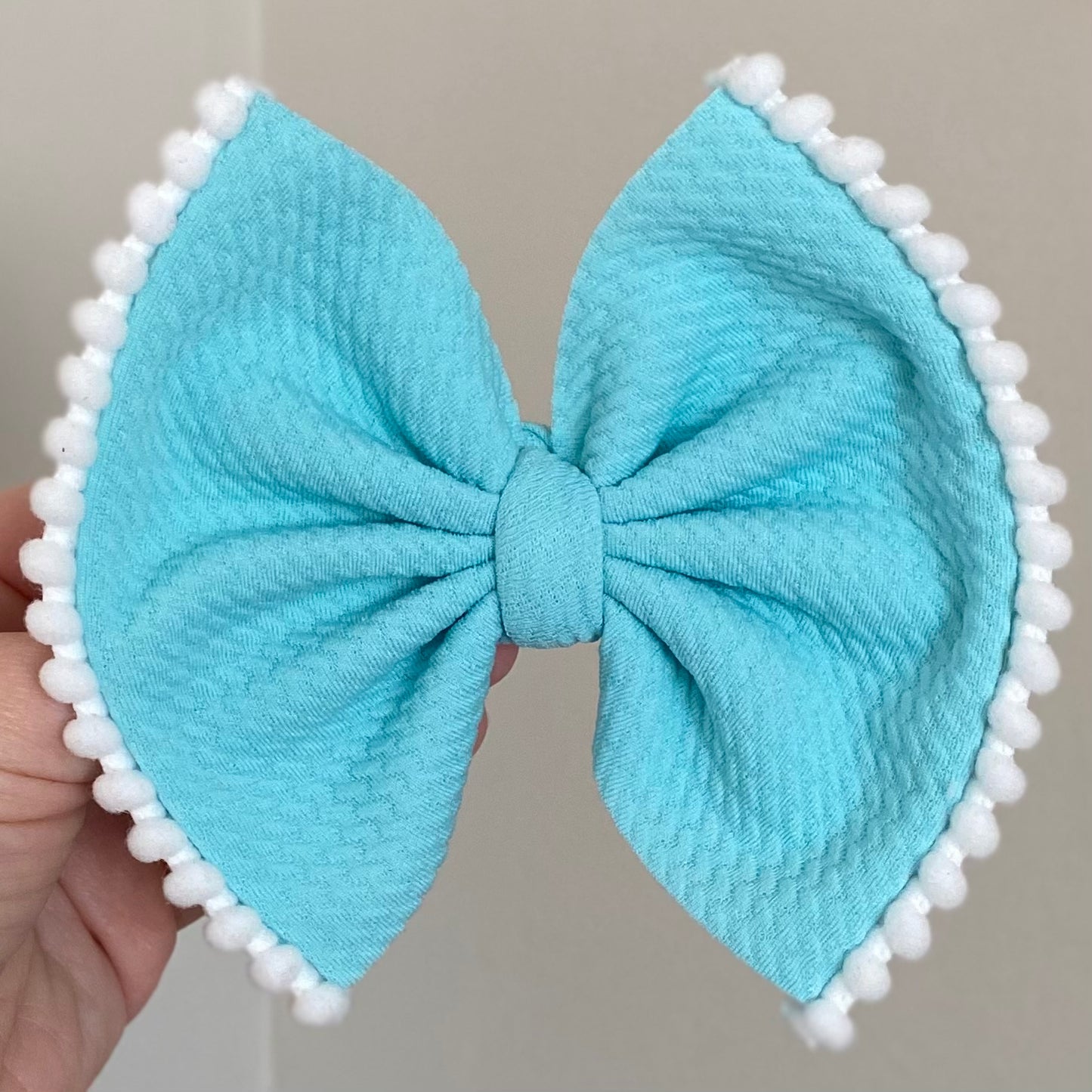 Pom Pom Trimmed Bow
