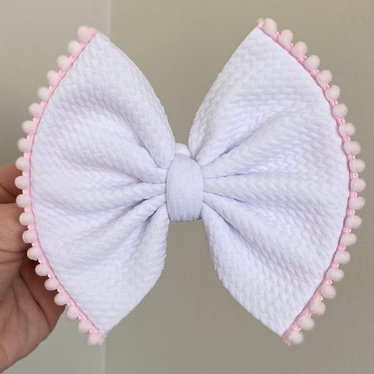 Pom Pom Trimmed Bow